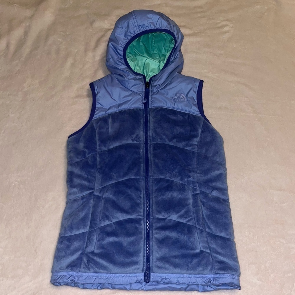 The North Face purple reversible vest with green trim, youth size 14/16